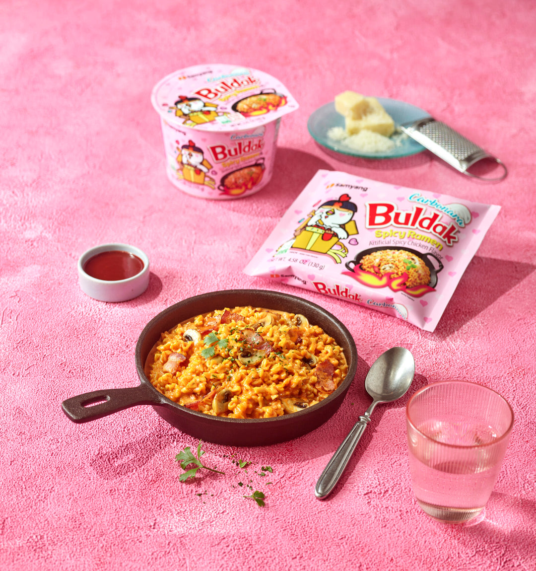 Buldak instant noodle meal set on a pink background