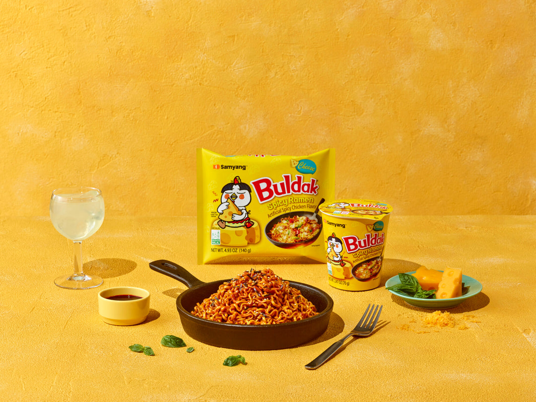 Buldak instant noodles packaging with a bowl of noodles on a yellow background